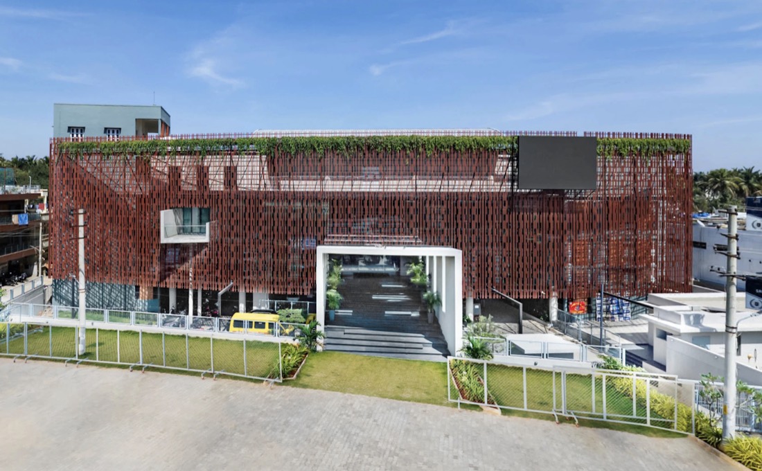 The PU building with its terracotta lattice facade and white entrance portal