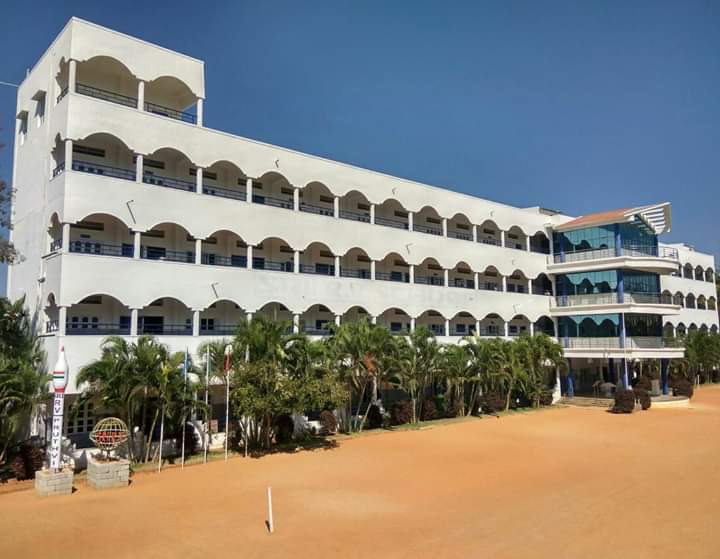 The arched white building of Sri R.V. School